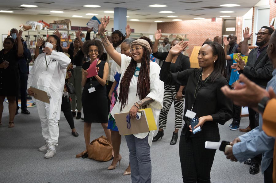 Centre of Excellence for Black Student Achievement staff waving hello. Open Gallery